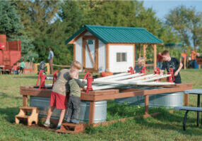 Kids doing the duck races at Big Springs Farm Pupkins & Corn Maze in Lanesboro, MN