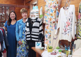 Two women standing in Stone Mill Clothing & Gifts in Lanesboro, MN